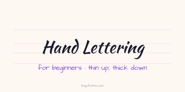 Hand lettering for beginners example: the words Hand Lettering in Kaushan Script brush lettering on practice guidelines